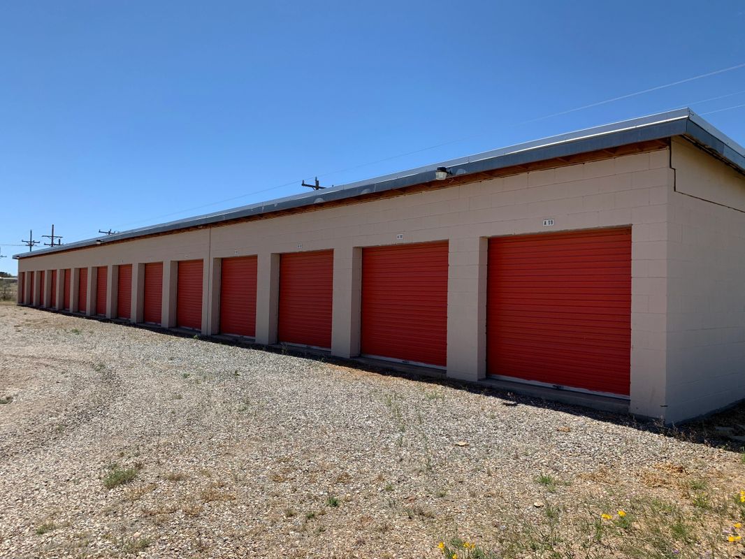 Red garage doors on storage building
