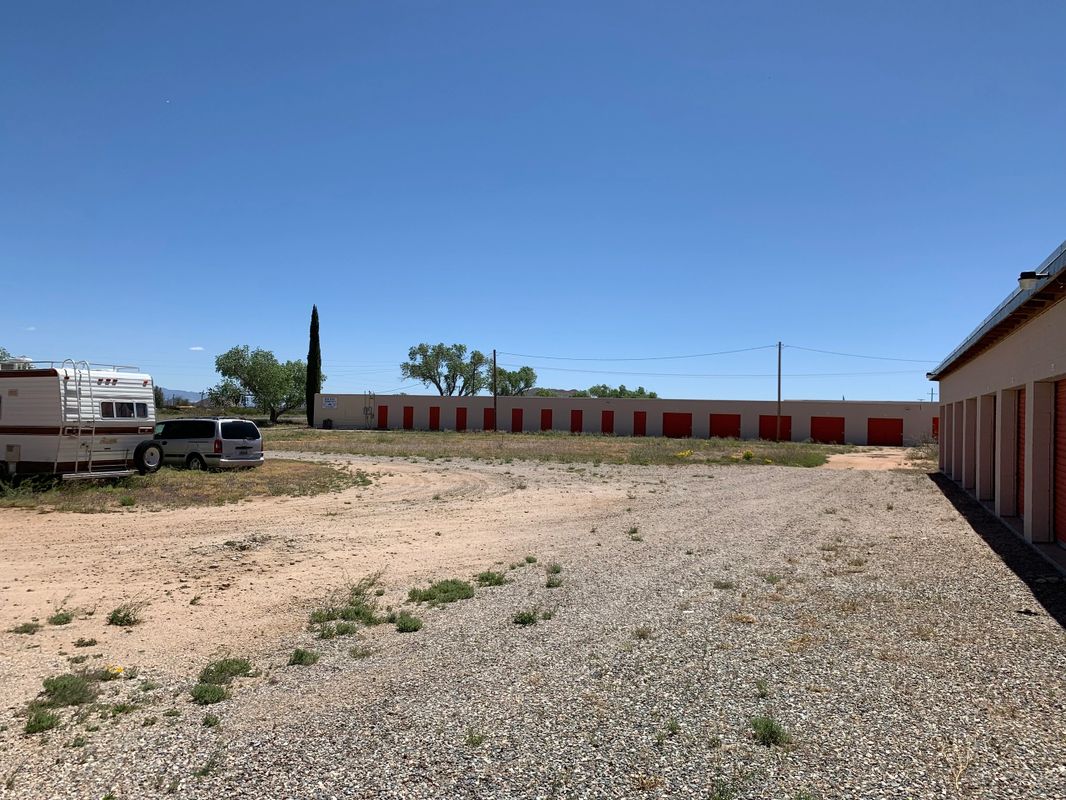 Gravel lot and parked vehicles