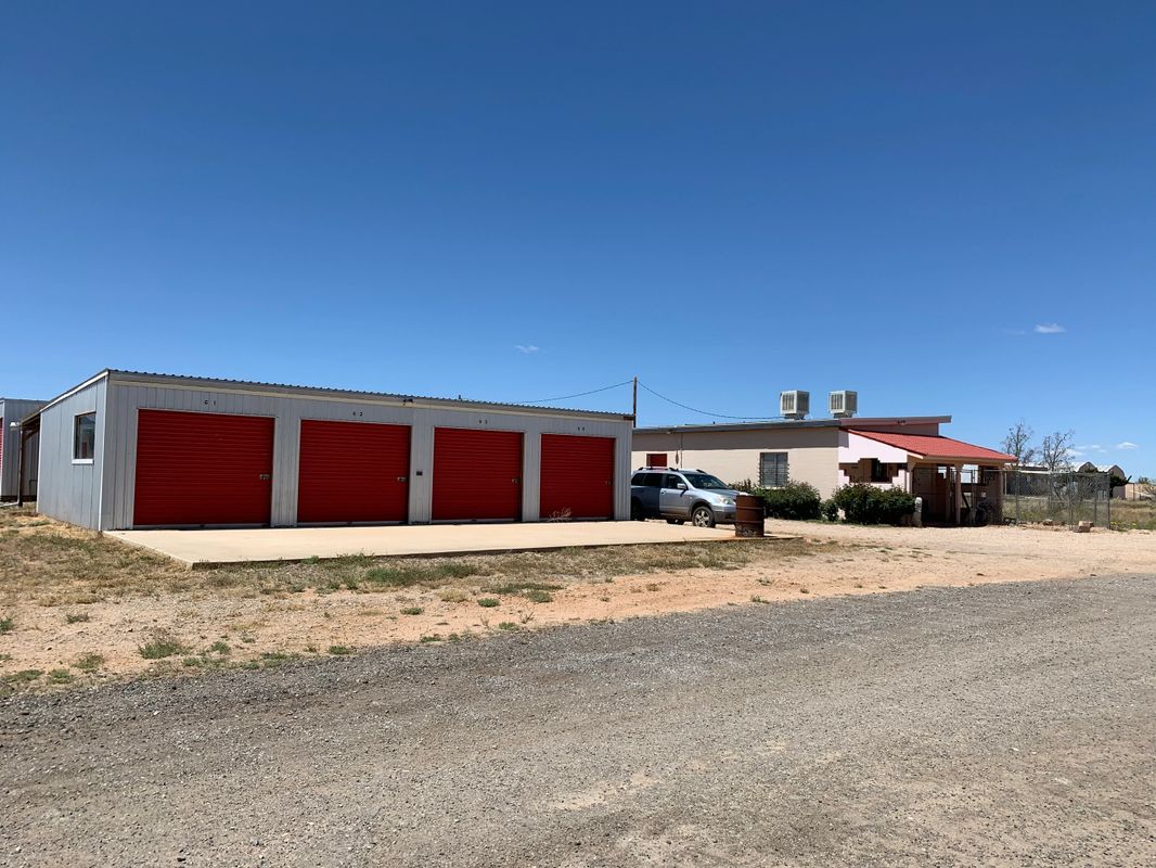 Rural scene with garages and house